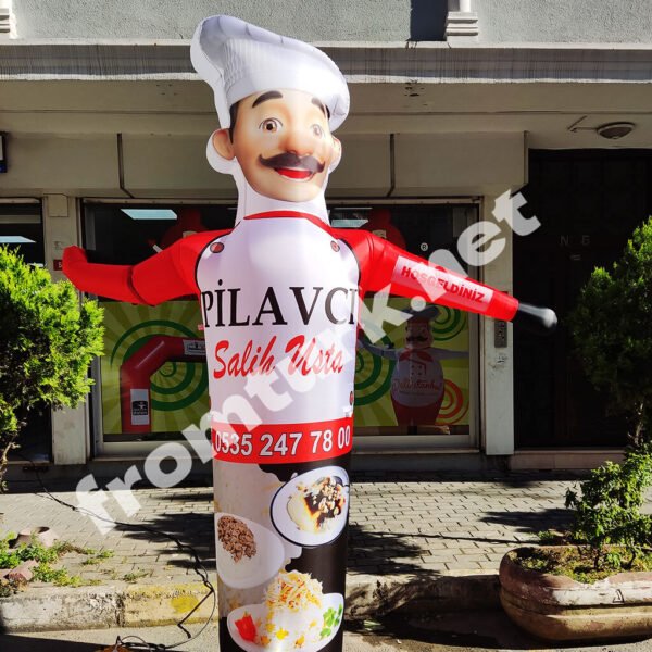 Inflatable chef balloon placed outside a restaurant to attract customers.