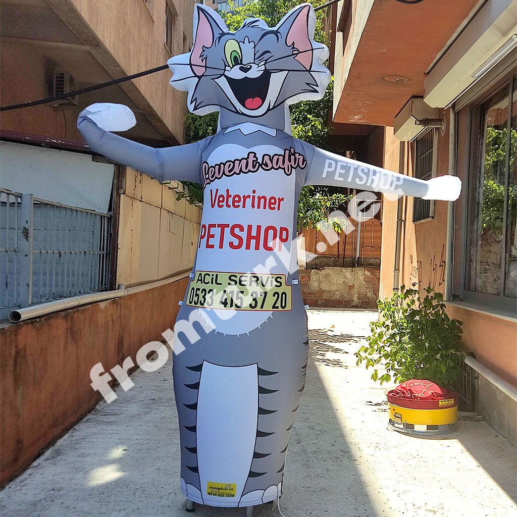 Large inflatable pet balloon displayed outside a veterinary clinic for promotional purposes.