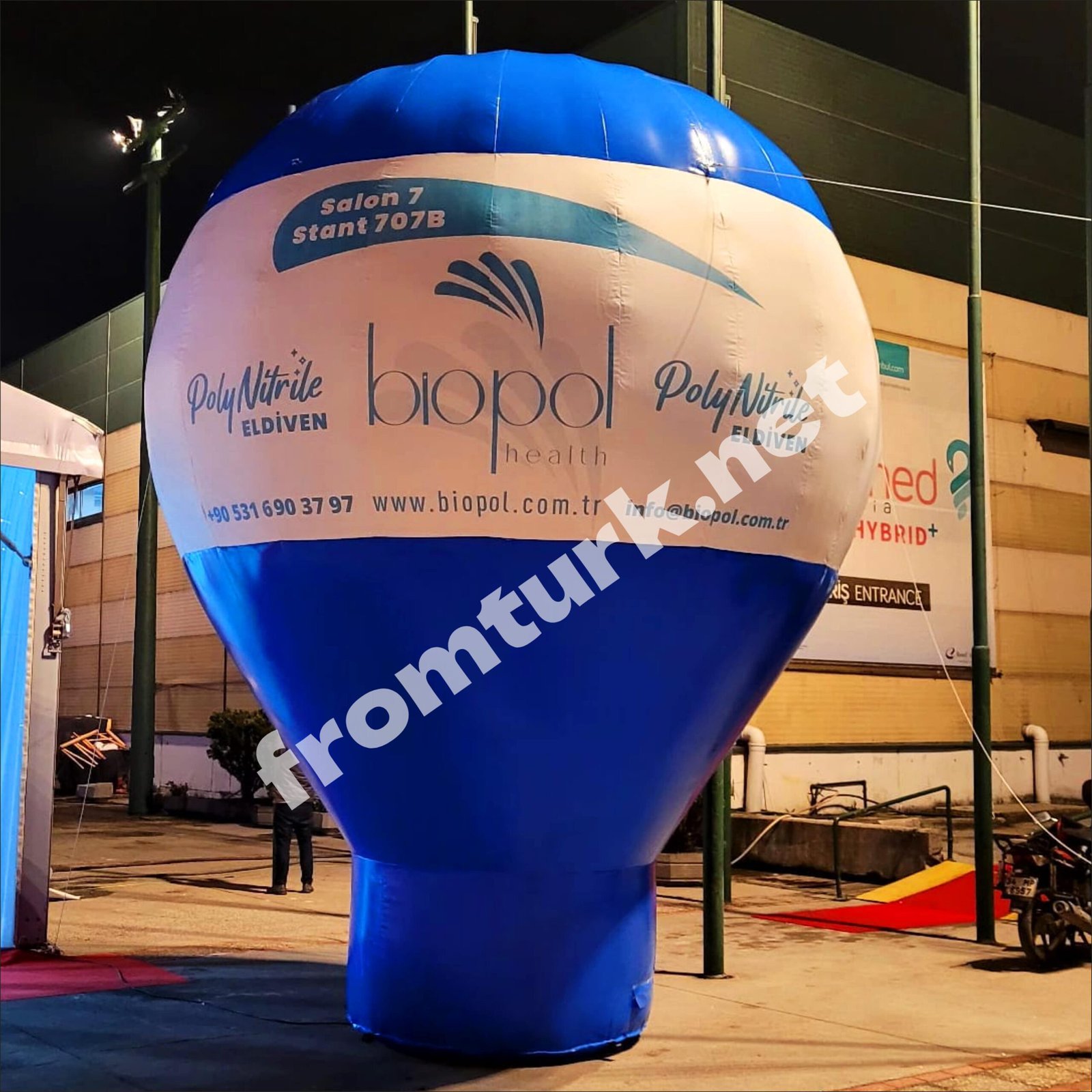 Large inflatable ground balloon set up outdoors for promotional branding.